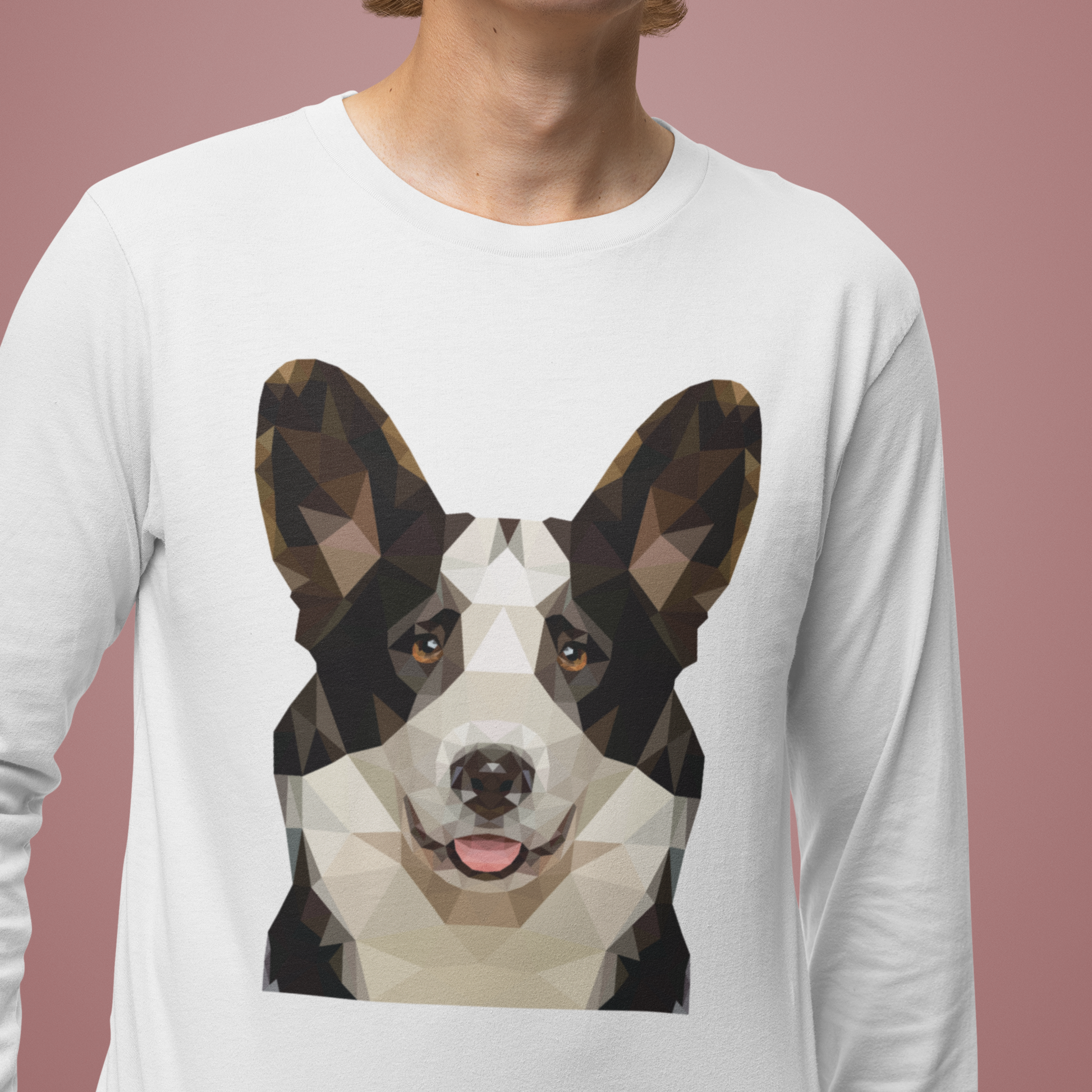 A model wearing a white long sleeved t shirt with a polygonal cardigan corgi's face on it. 