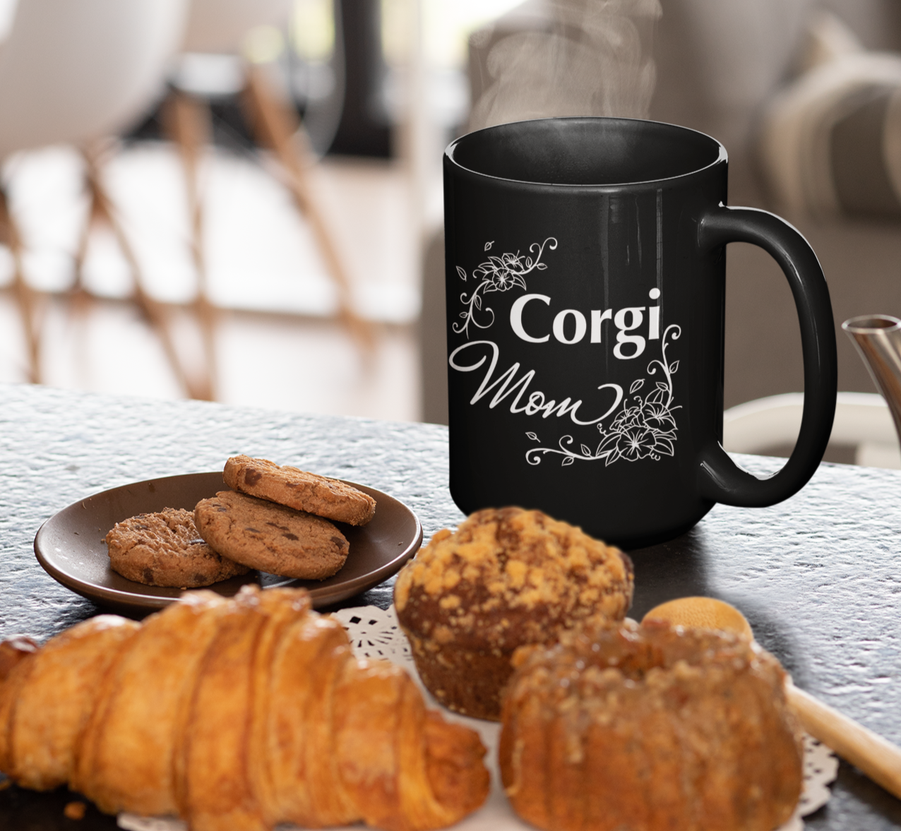 Black mug with flowery "Corgi Mom" text.