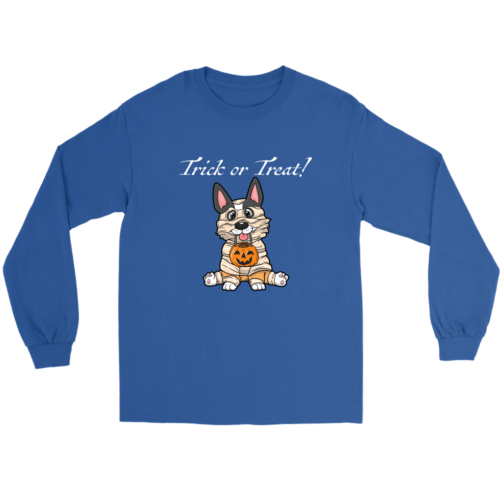 A flat lay of a blue, long sleeved t shirt. The design of the shirt is a tricolor corgi dressed up as a mummy, and is holding a pumpkin trick or treat container. The text above the dog is white and says "Trick or Treat!"