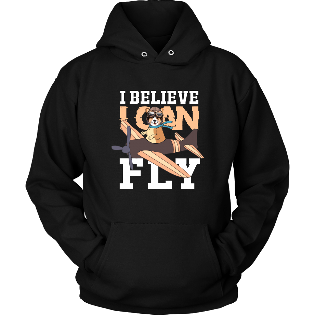 A flat lay of a black hoodie that has a corgi flying a play with the text "I believe I can fly".