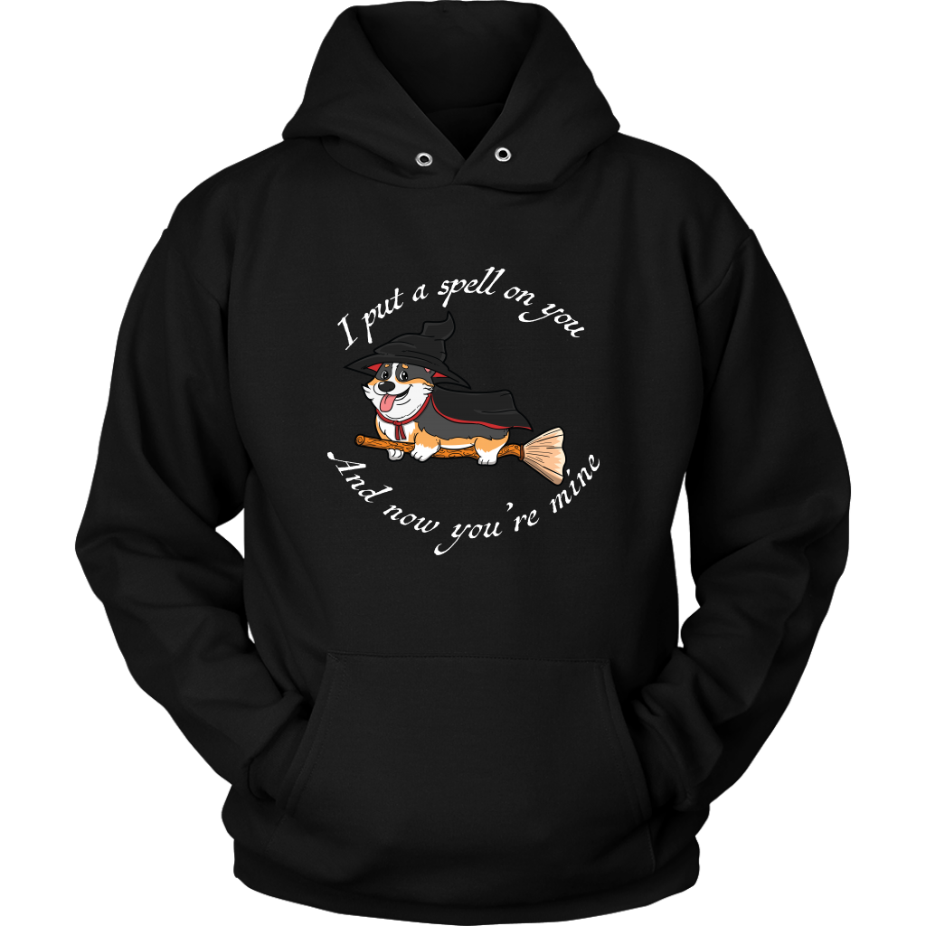 A hoodie with a corgi dressed as a witch with the text "I put a spell on you and now you're mine". The hoodie is black. 