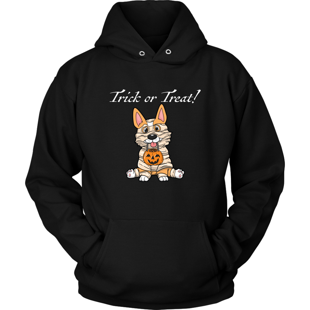 A image of a fawn corgi dressed up as a mummy with the text "trick or treat". The hoodie is black.