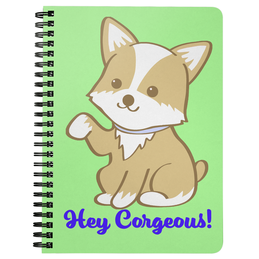 A journal, the background of the cover is green and the text says "Hey Corgeous!", and there's a waiving corgi.