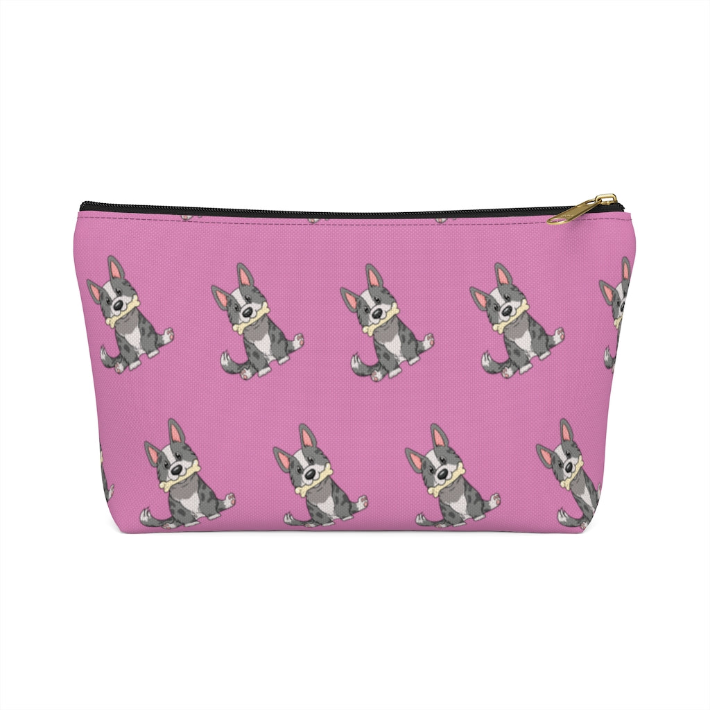 Pink make up bag with a pattern of a cardigan corgi holding a bone in its mouth, black zipper