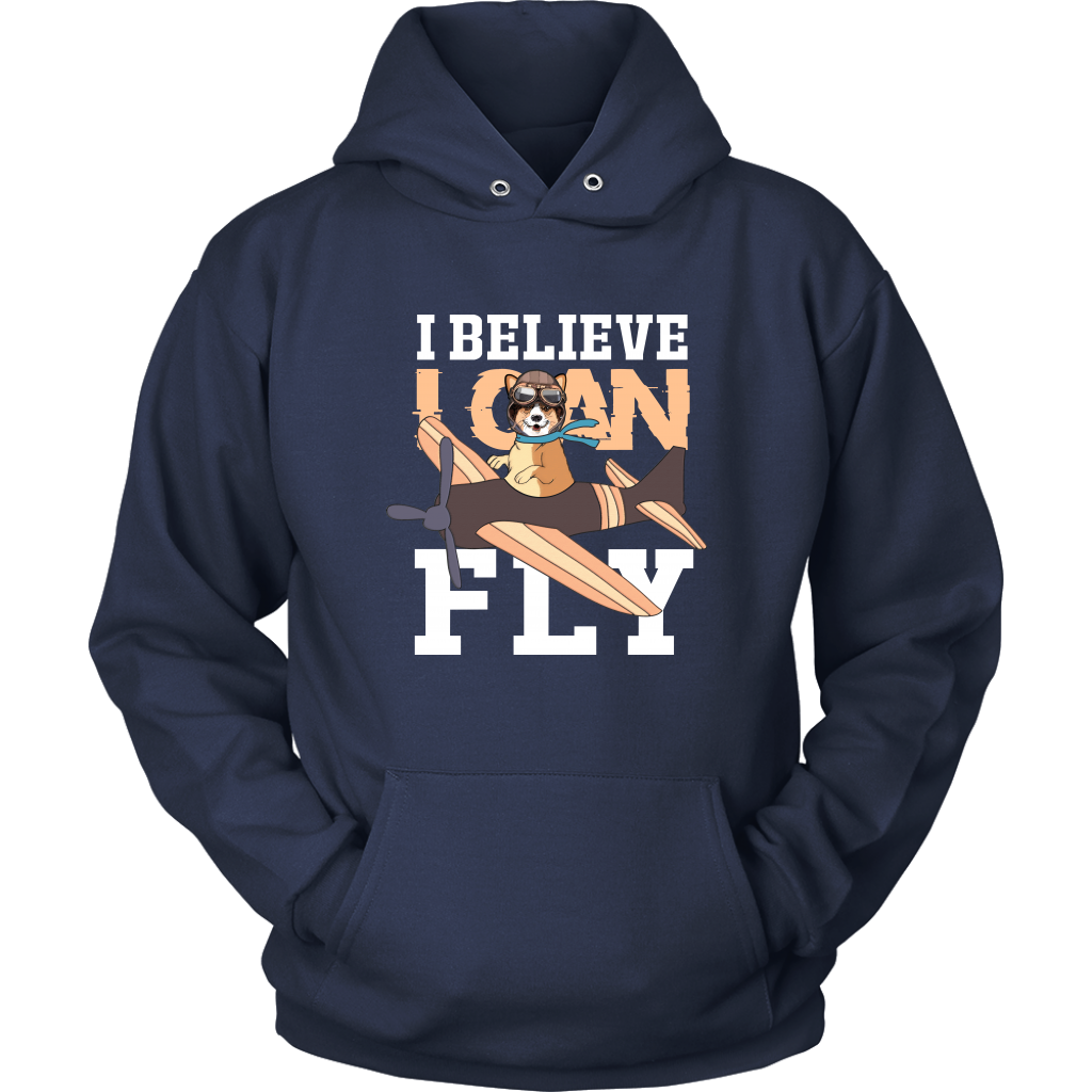 A flat lay of a dark blue hoodie that has a corgi flying a play with the text "I believe I can fly".