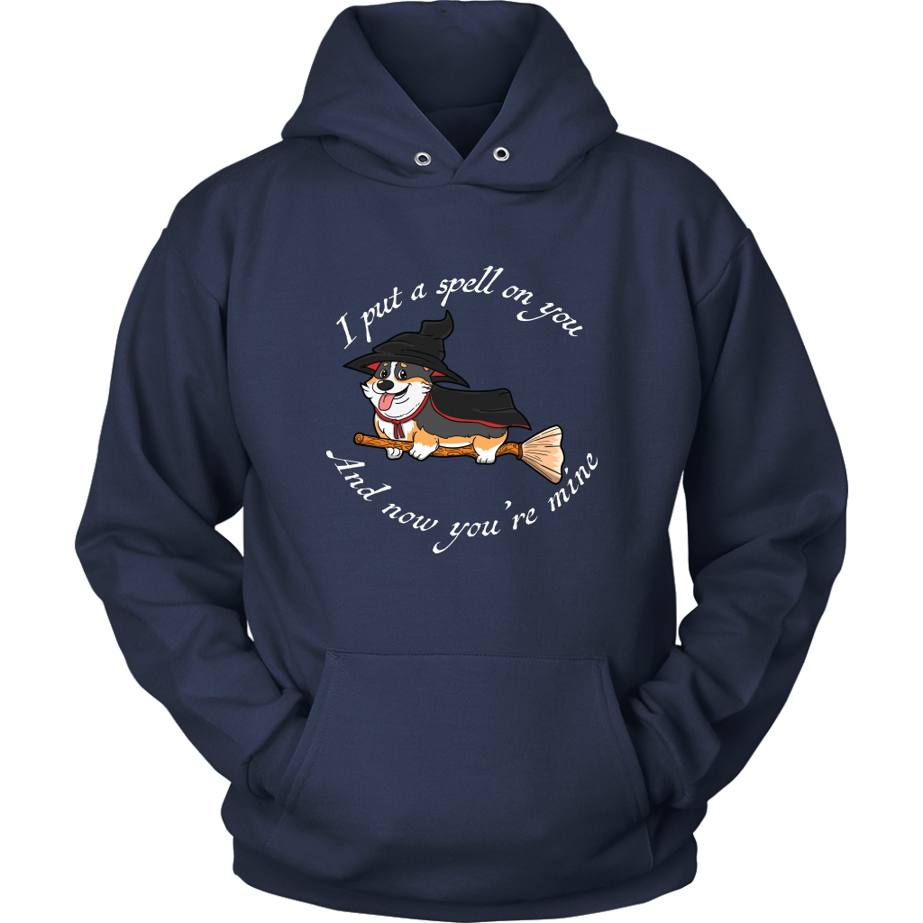 A hoodie with a corgi dressed as a witch with the text "I put a spell on you and now you're mine". The hoodie is navy blue. 