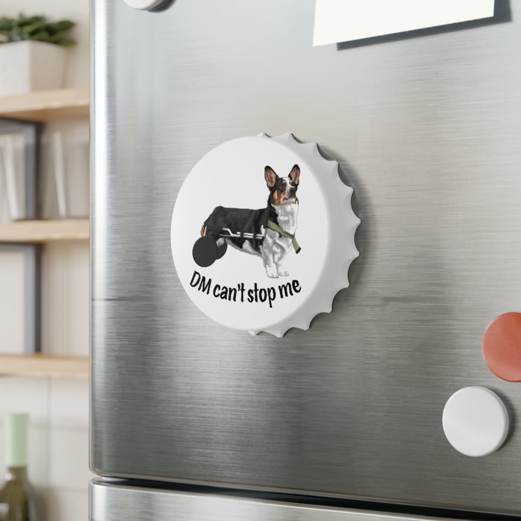 A bottle opener that's magnetically stuck to a fridge. The design on the opener is a tricolor corgi that is in a dog wheelchair. The text is in black and says "DM Can't stop me".