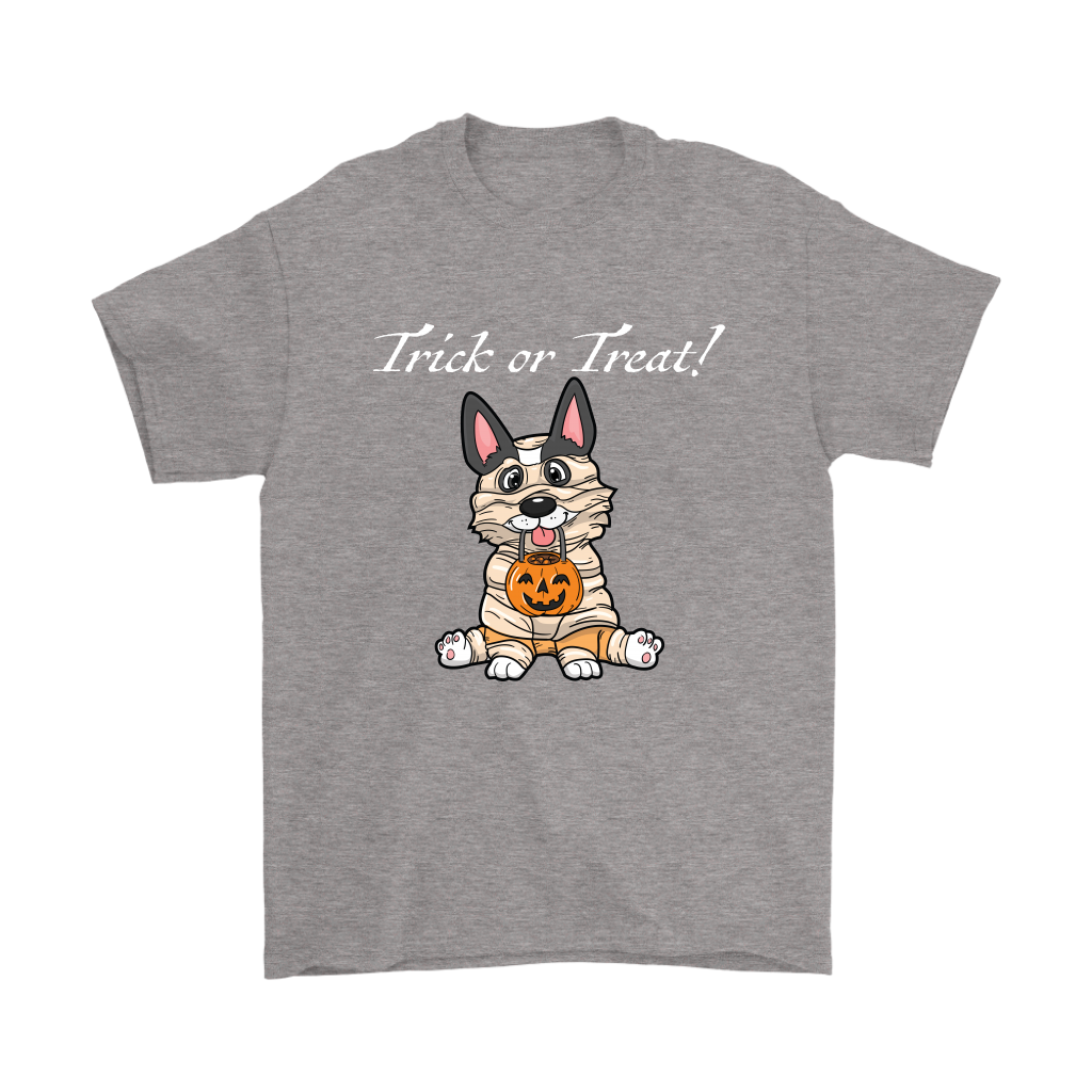 A t shirt with a tricolor corgi wearing a mummy costume. The text says "Trick or Treat" and the shirt is grey.