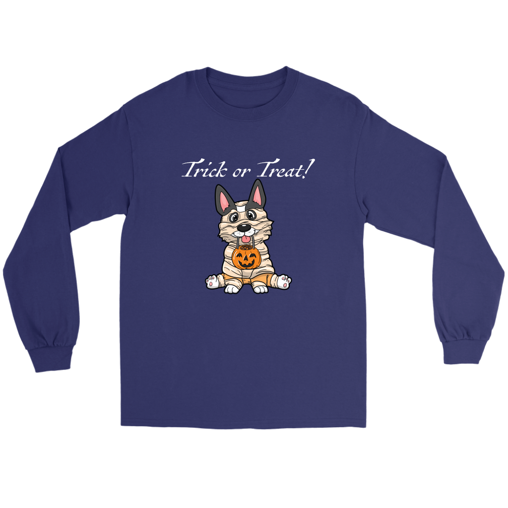 A flat lay of a dark blue, long sleeved t shirt. The design of the shirt is a tricolor corgi dressed up as a mummy, and is holding a pumpkin trick or treat container. The text above the dog is white and says "Trick or Treat!"