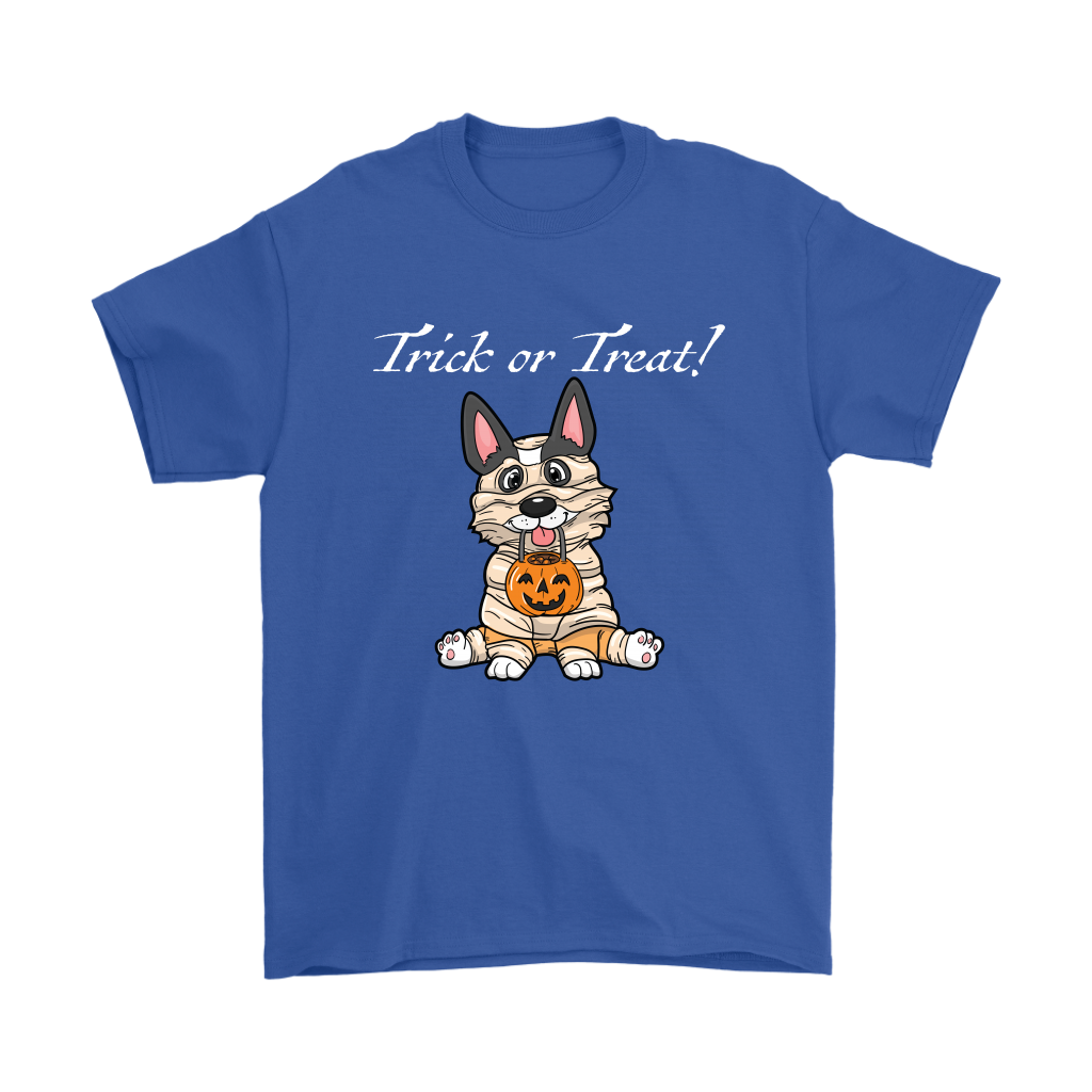 A t shirt with a tricolor corgi wearing a mummy costume. The text says "Trick or Treat" and the shirt is blue