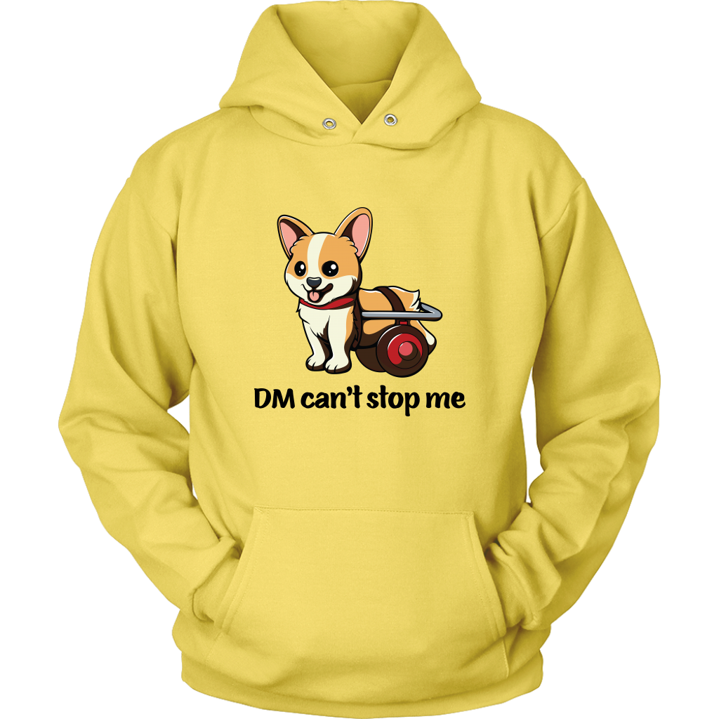 A flat lay of a hooded sweatshirt. The design of the hoodie is a fawn, smiling corgi in a doggie wheelchair. The text below the corgi is "DM can't stop me". The hoodie is yellow colored. 