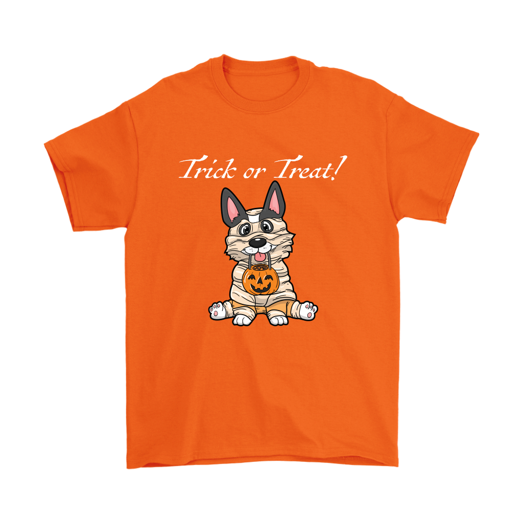 A t shirt with a tricolor corgi wearing a mummy costume. The text says "Trick or Treat" and the shirt is orange.