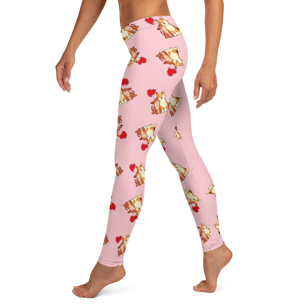 A model wearing pink leggings with a pattern of a corgi and a cat snuggling.