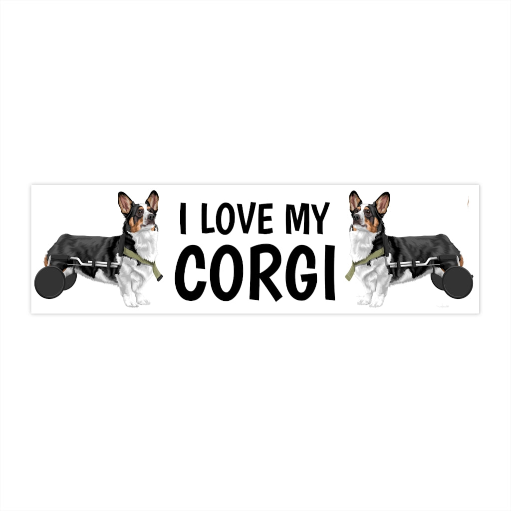 A bumper sticker that has the text "I love my corgI' that is flanked by two tricolor corgis in wheelchairs. 