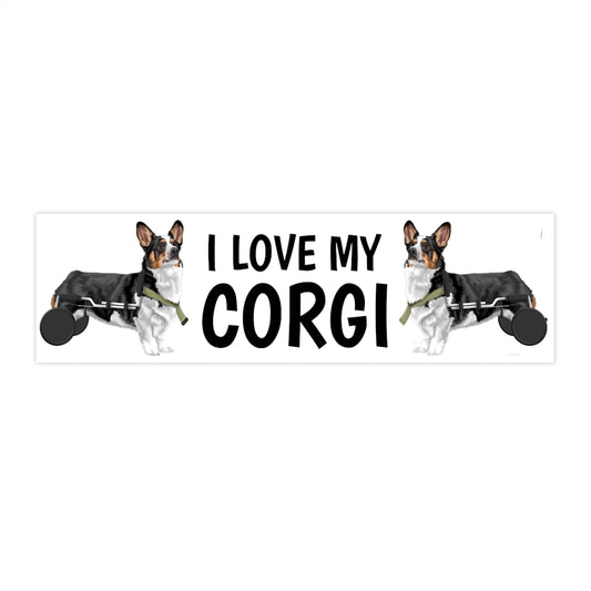 A bumper sticker that has the text "I love my corgI' that is flanked by two tricolor corgis in wheelchairs. 