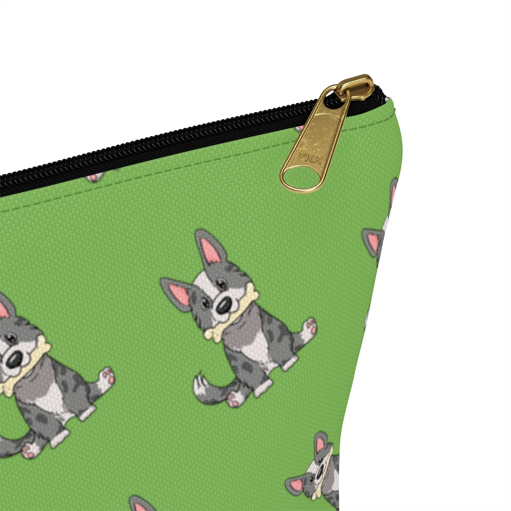 alt tag: Green make up bag with a pattern of a cardigan corgi holding a bone in its mouth, zoom in on zipper