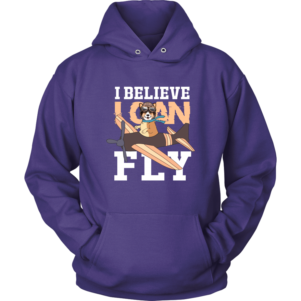 A flat lay of a purple hoodie that has a corgi flying a play with the text "I believe I can fly".