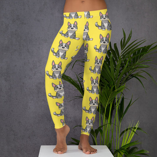 Yellow leggings with a pattern of a cardigan corgi holding a bone in its mouth, from the front