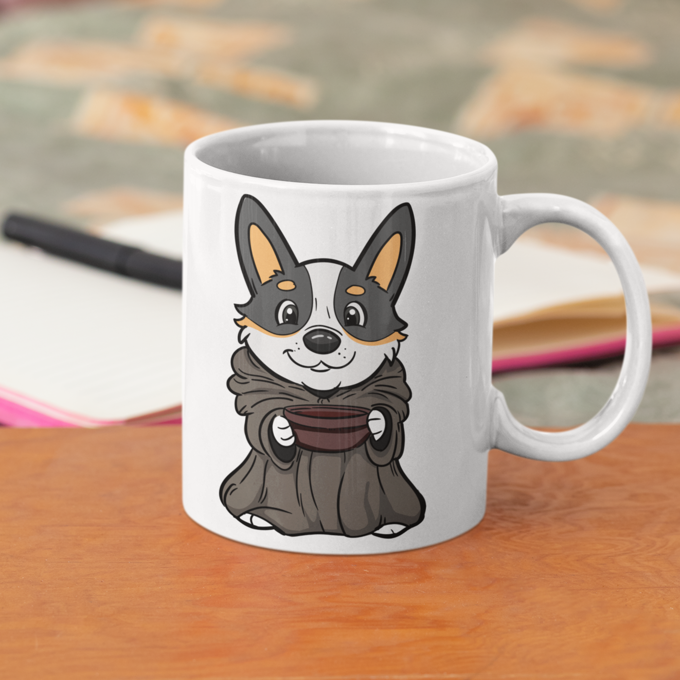 Baby Yoda Corgi Mug sitting on a desk.