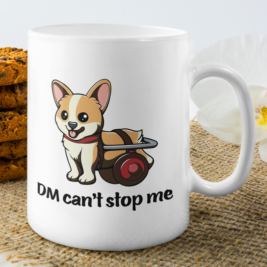 A mug sitting on a table. The mug is white and has a picture of a corgi in a wheelchair. The text says "DM Can't stop me".