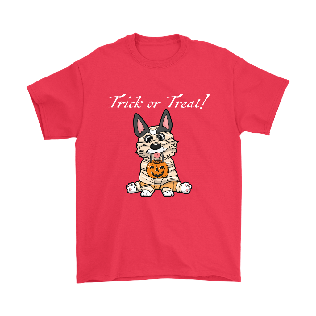 A t shirt with a tricolor corgi wearing a mummy costume. The text says "Trick or Treat" and the shirt is red.