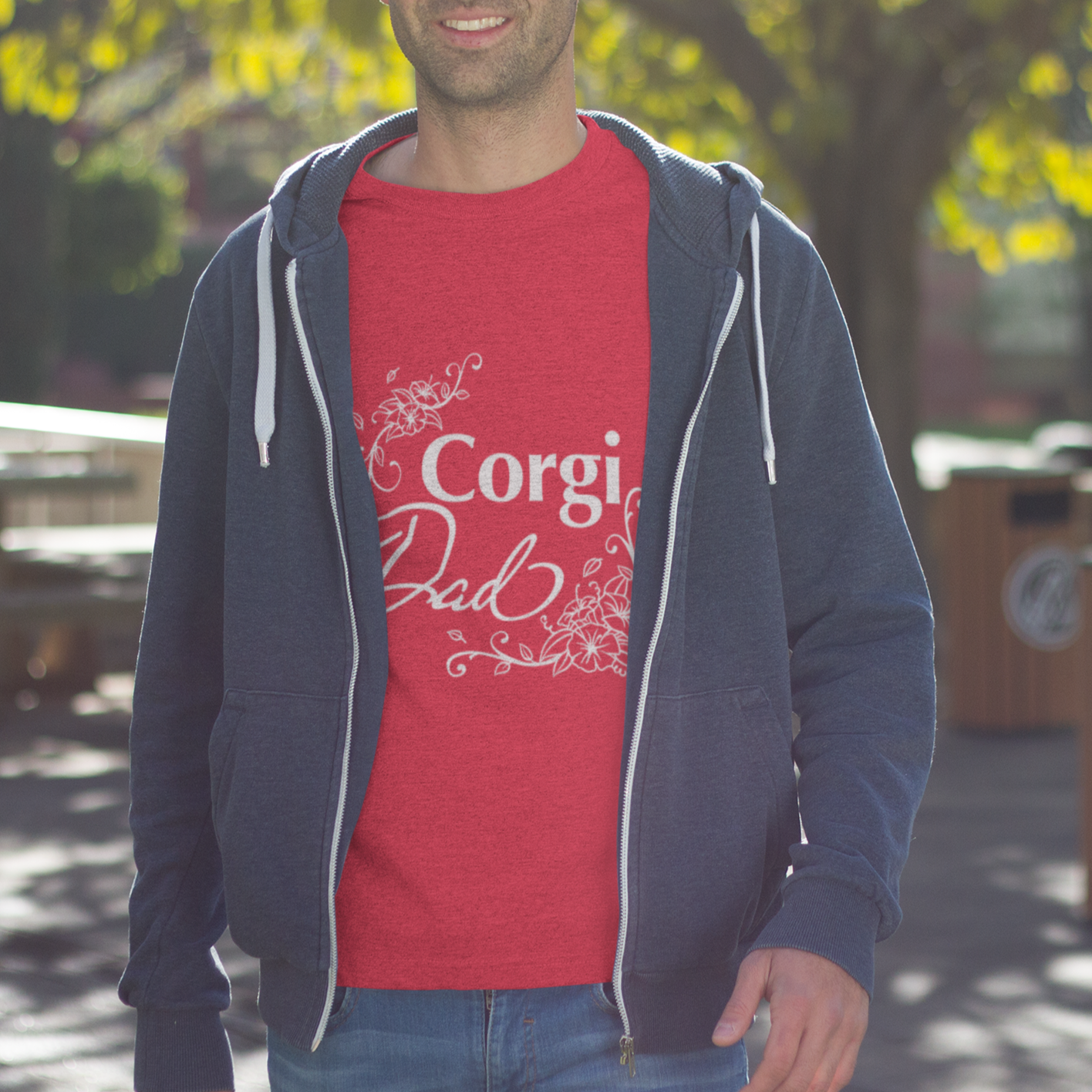 A man wearing a "Corgi Dad" shirt. The text has a flowery font.